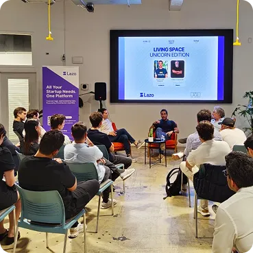 Founders watching a panel at a Lazo Living Space session